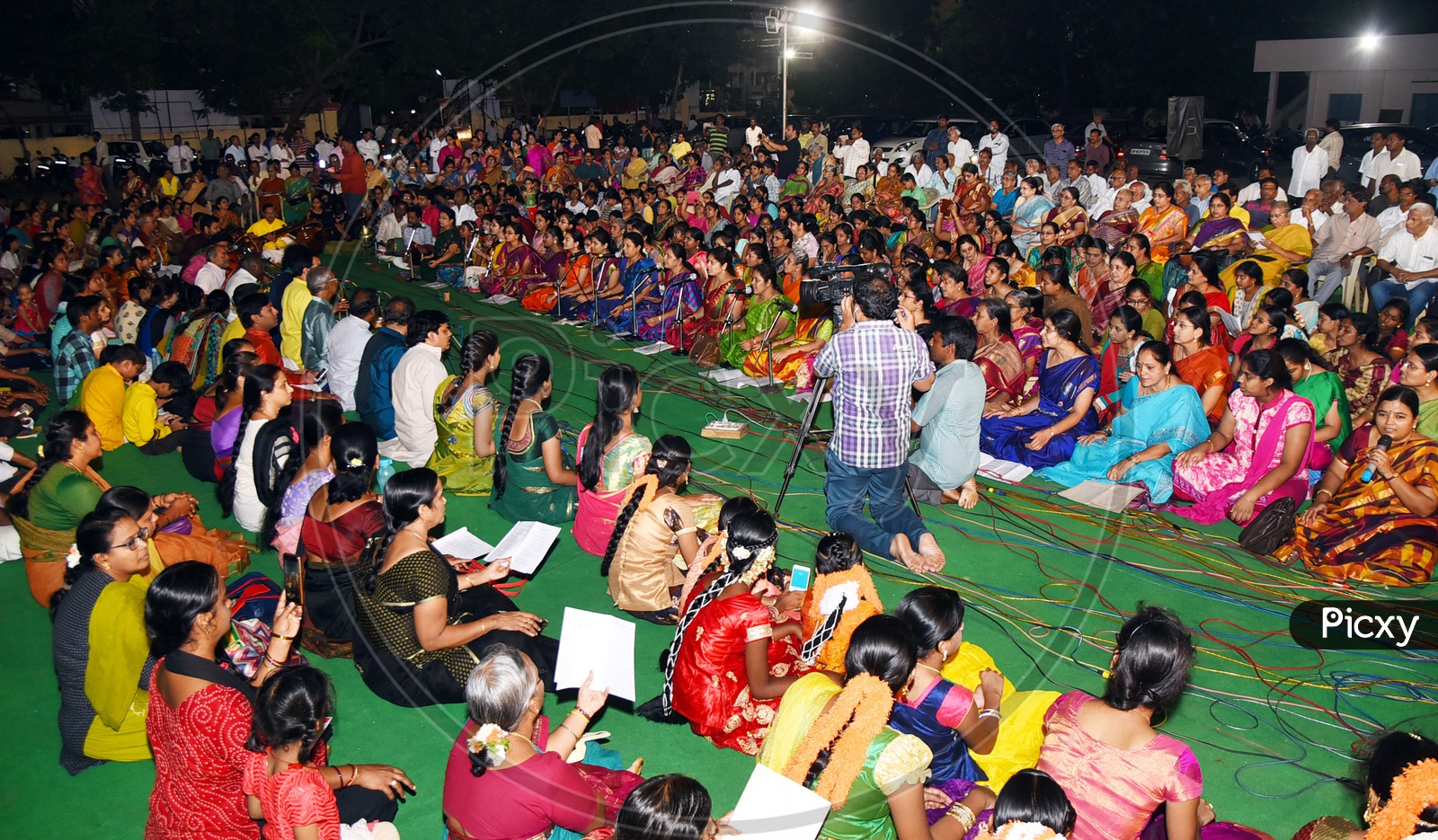 Indian singers singing kirtans at a gathering