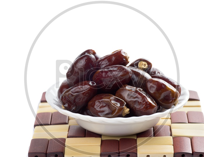 Dates in a white bowl