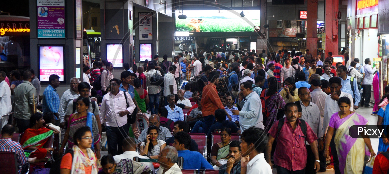 Passengers Waiting in a Railway Station