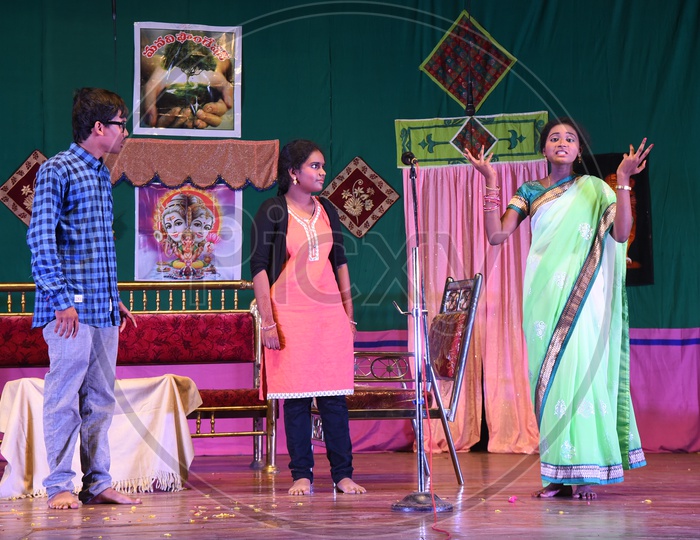 Children enacting a play on the stage