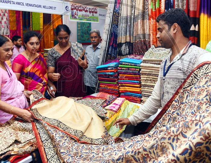 Women checking the sarees