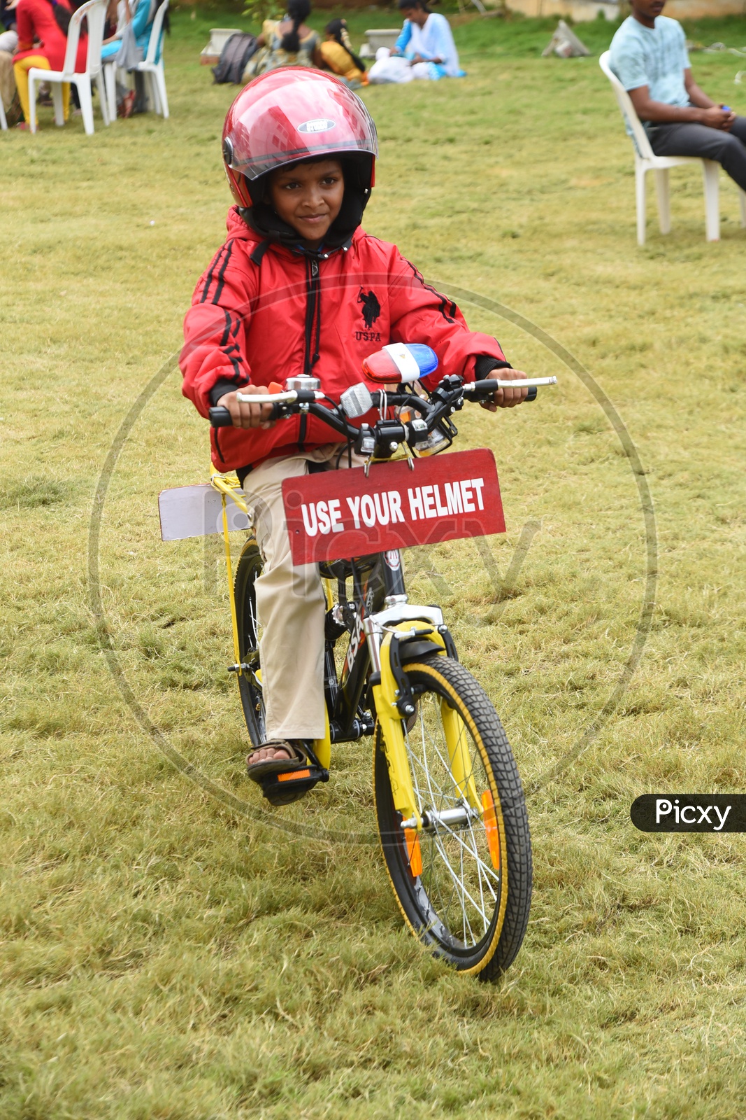 A Young Girl Promoting Use Your Helmet
