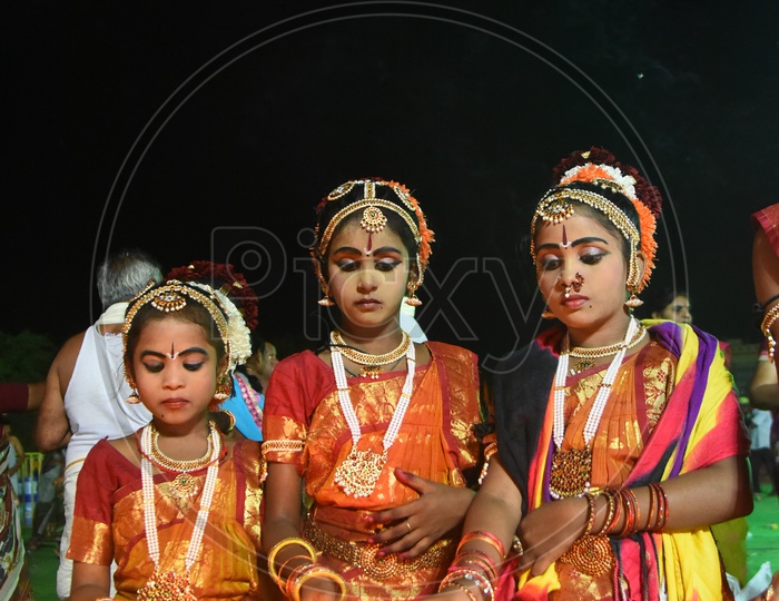 Girls in Traditional Attire Lighting Dias