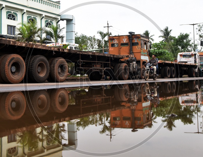 Reflection of heavy trailer truck after rain