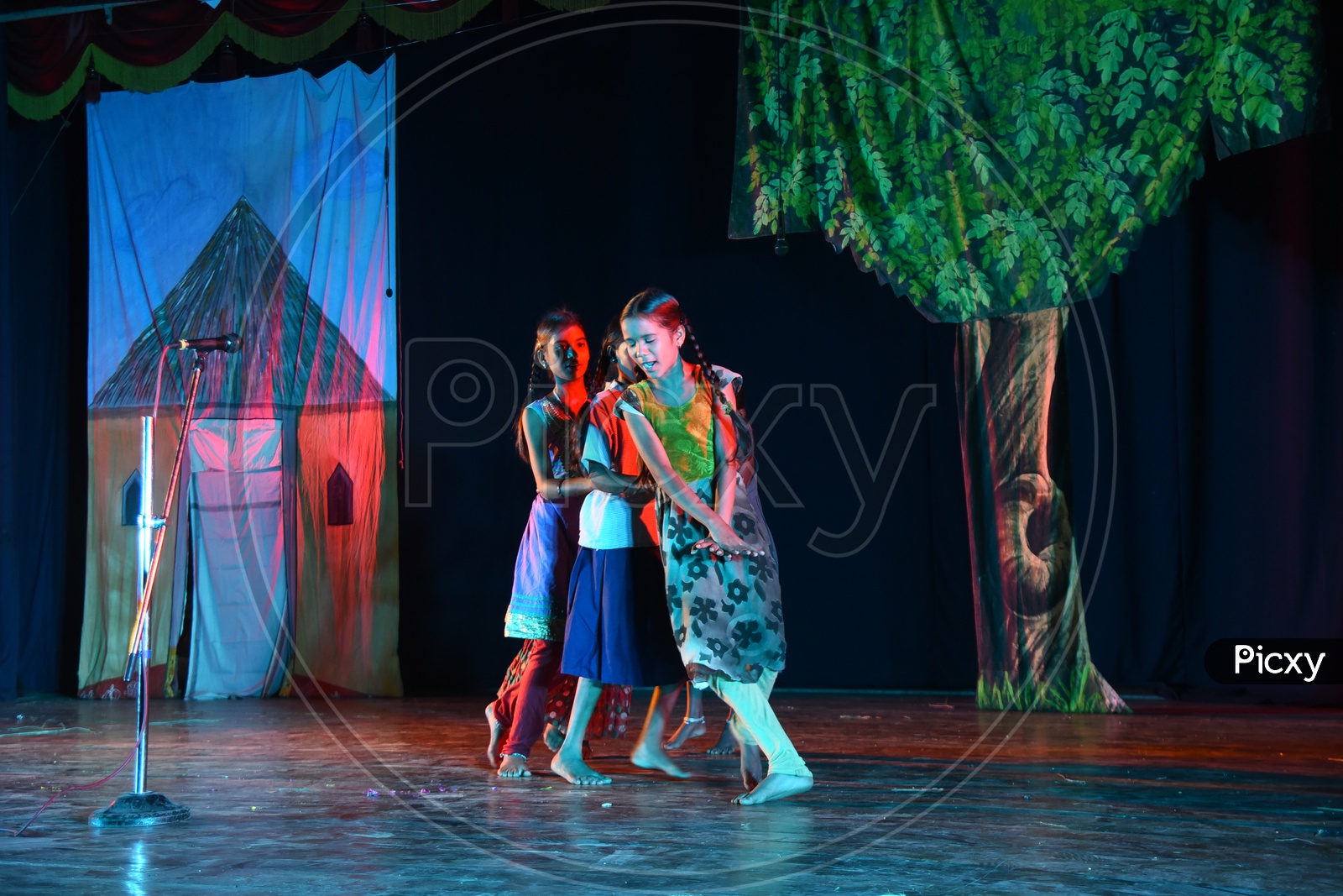 Girl children performing a dance on the stage