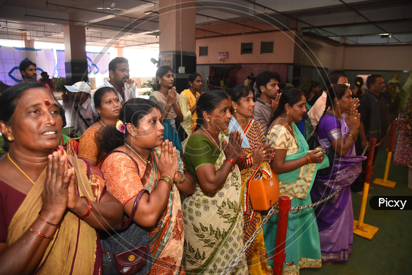 Devotees during worship in a temple