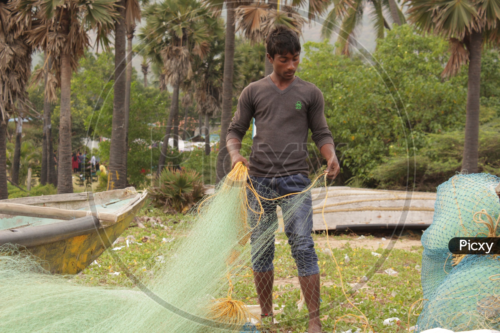 fisherman detangling the fishing net