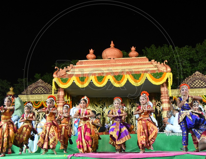 Students Performing Classical Dance On stage