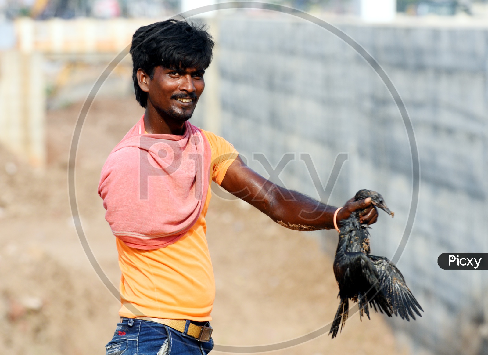 A Young Man Catches Cormorant
