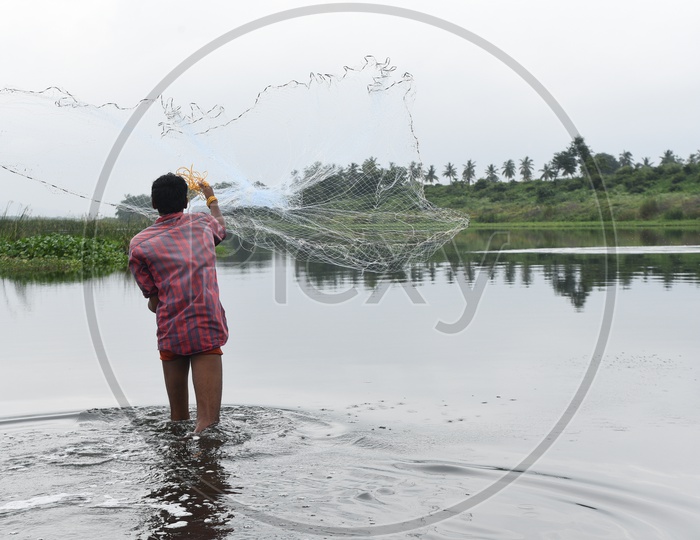 A man casting a fishing net