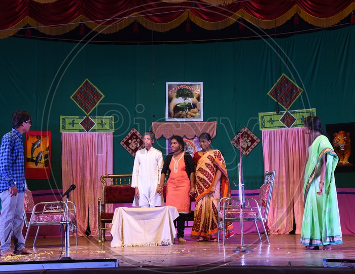 Children enacting a play on the stage