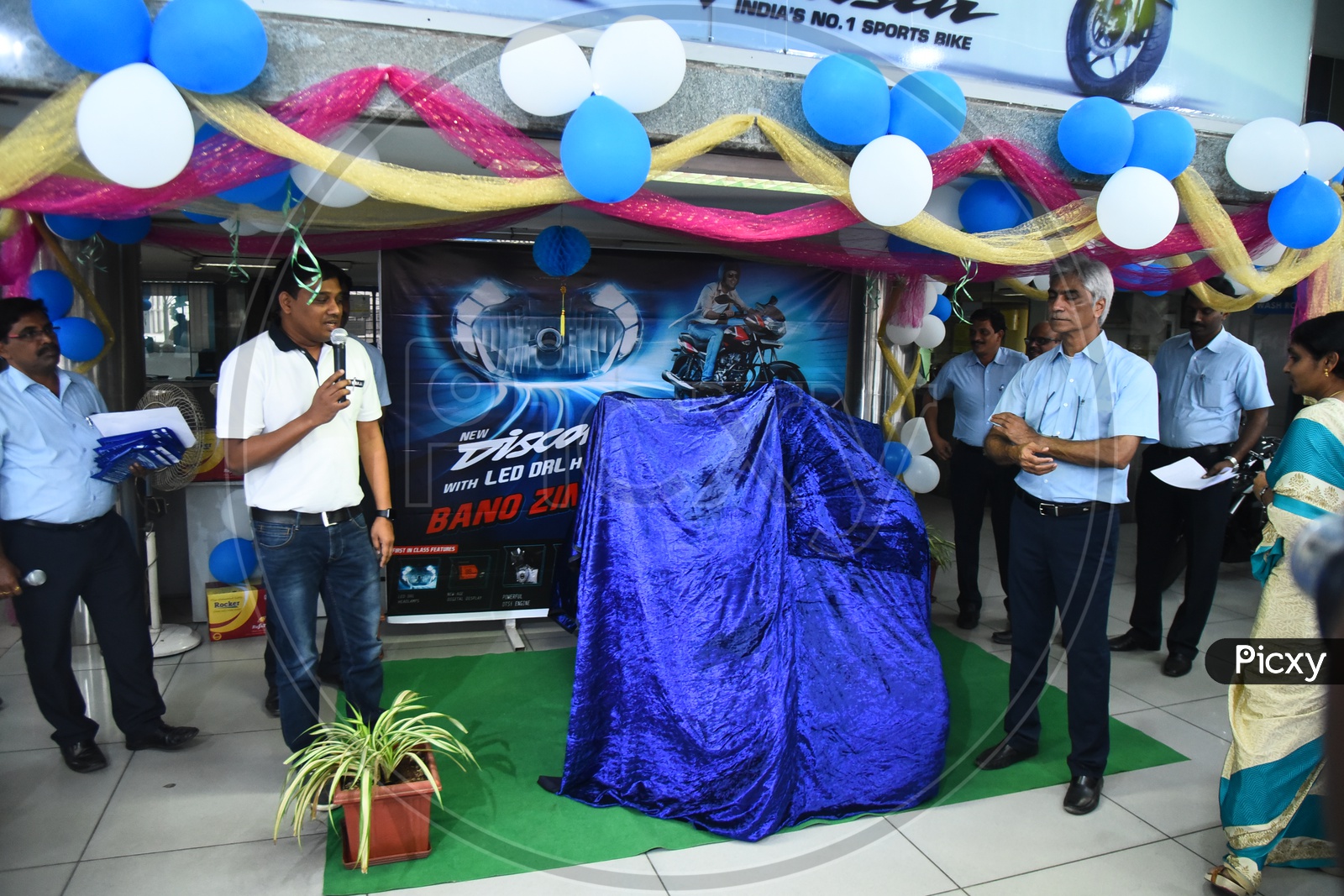 Staff launching the Bajaj Discover motrocycle