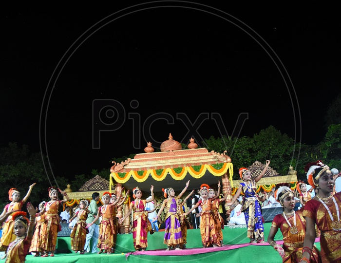 Students  Performing Traditional Dance on Stage