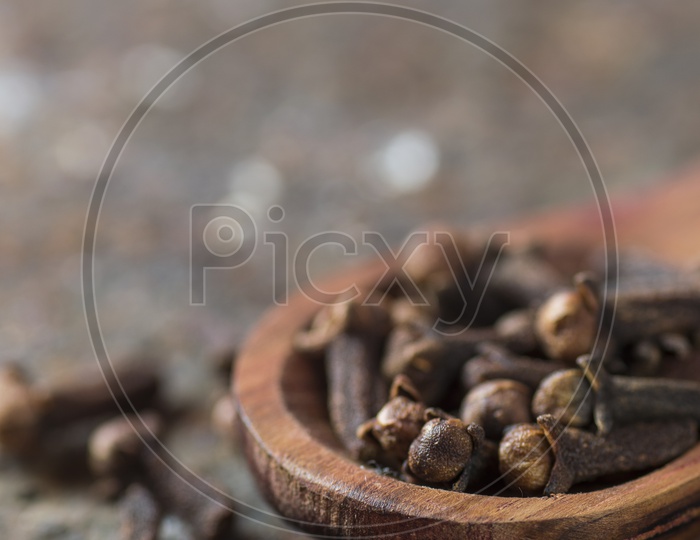 Close up shot of Clove in a wooden spoon