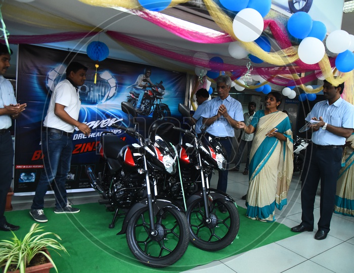 Staff during the launch of Bajaj Discover bike
