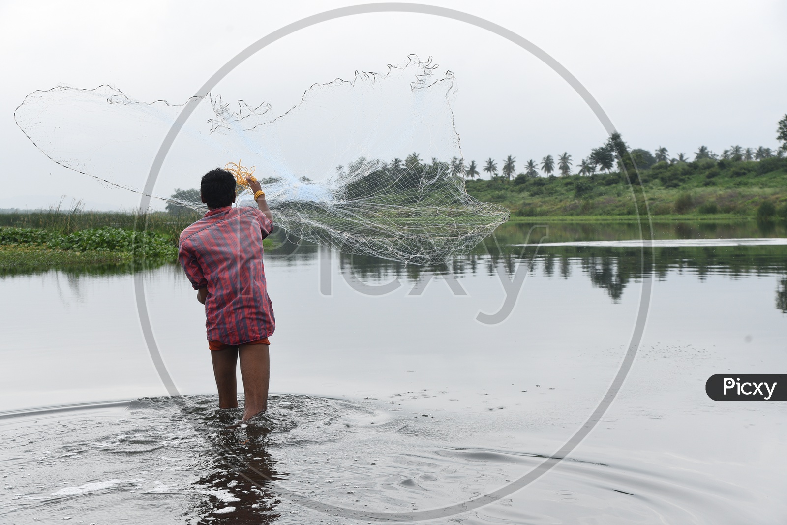 A man casting a fishing net