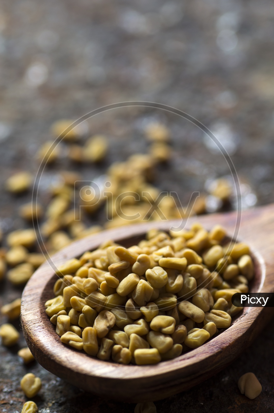Fenugreek Seeds in a wooden spoon