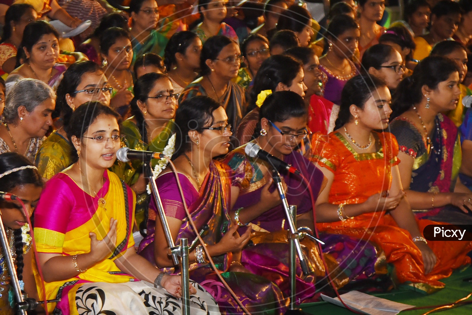 Indian women singing kirtans