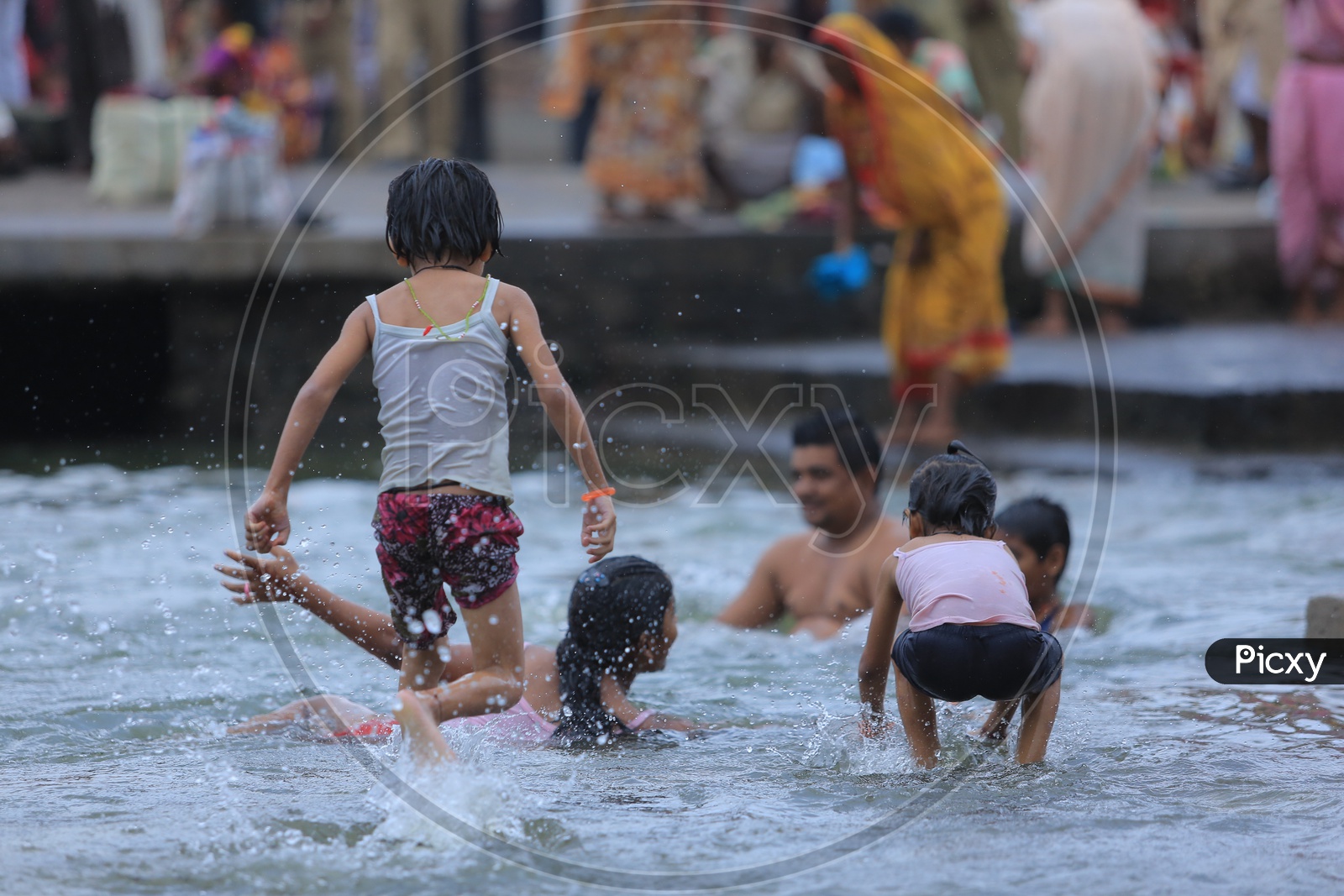 Children Taking Holy Bath In River Ganges During Kumbh mela