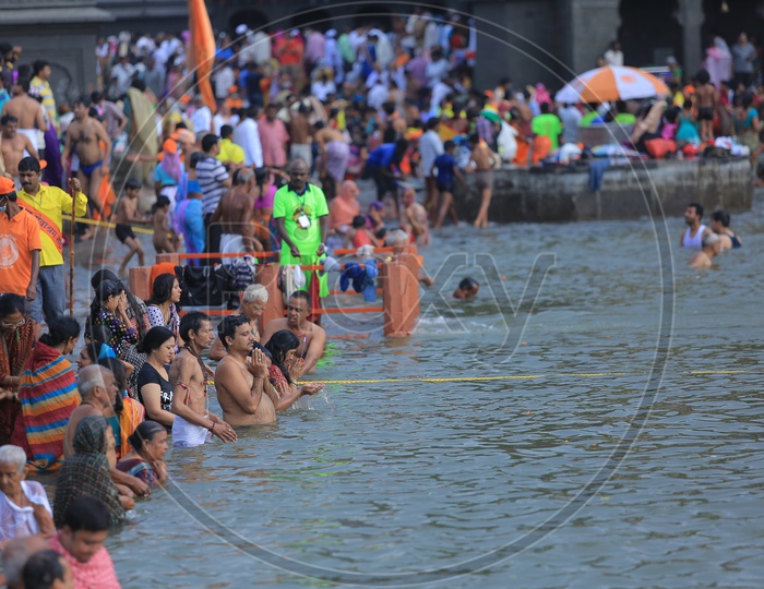Devotees Taking Holy Bath In River Ganges during Kumbh Mela
