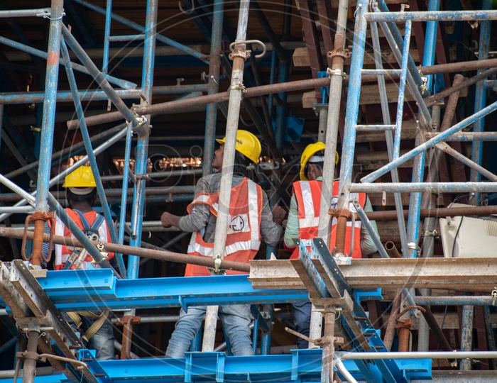 L&T CONSTRUCTION COMPANY WORKERS BUILDING SUSPENSION BRIDGE OVER DURGM CHERUVU, MADHAPUR, HDYERABAD.