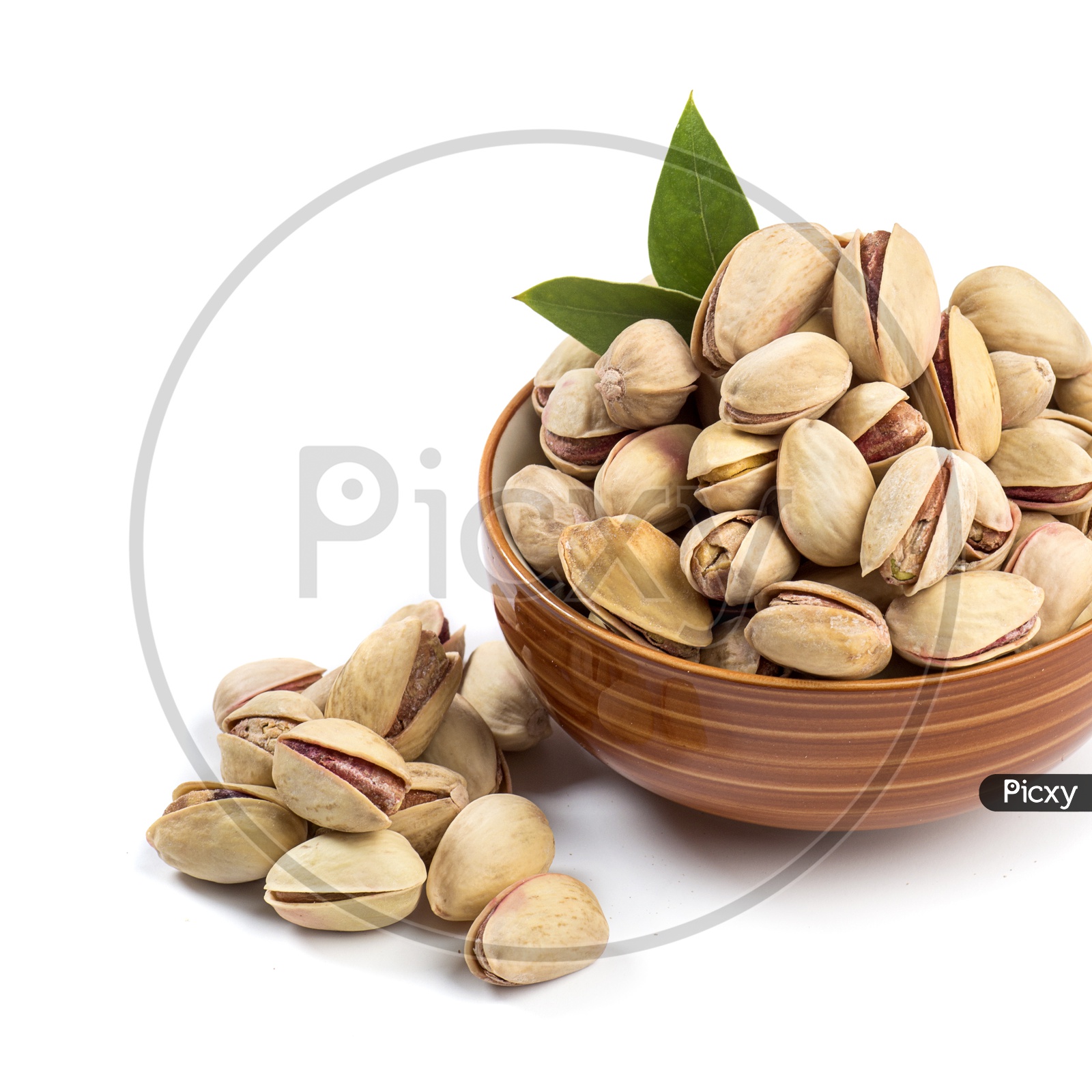 Pistachios in a Bowl on white Background