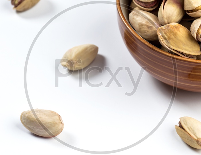 Pistachios in a Bowl on White Background