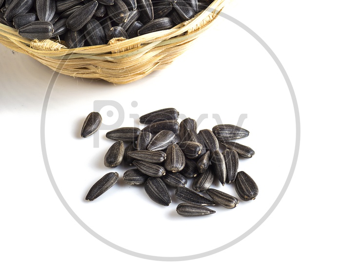 Black cardamom in a basket and on the surface