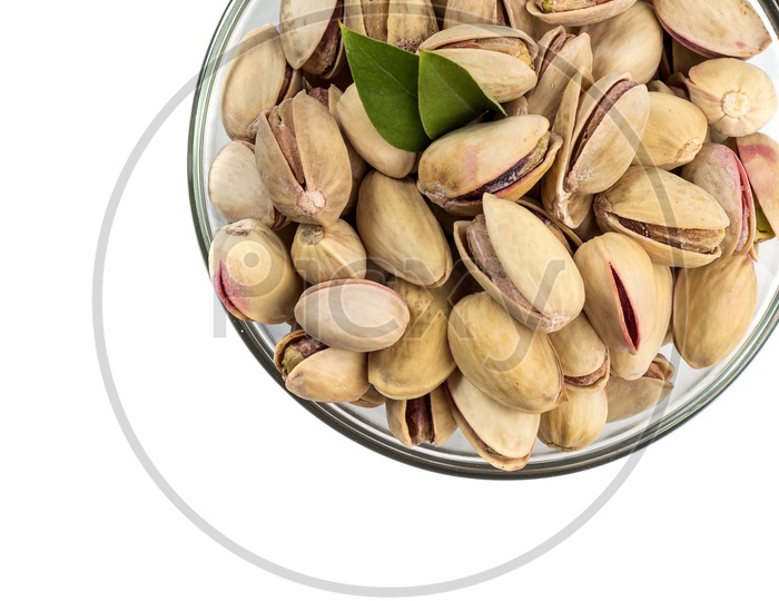 Pistachios in a Bowl on white Background