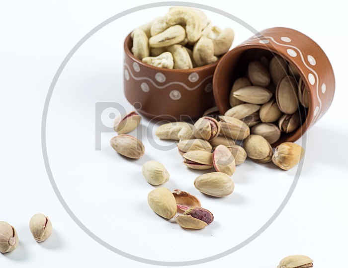 Pistachio's in a bowl on white background