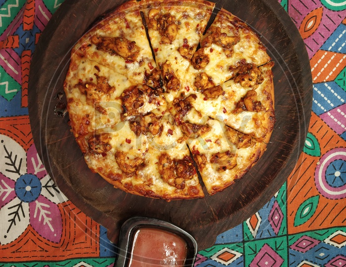 Pizza on the pan with sauce