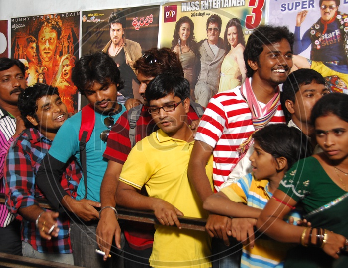 Crowd in a queue near the movie theater ticket counter