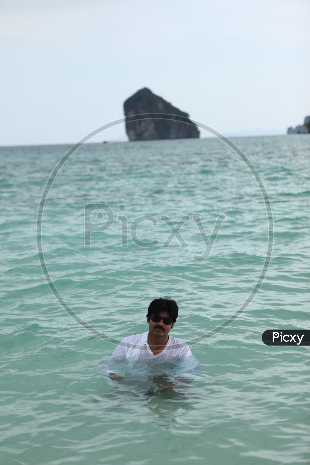 Tollywood actor Pawan Kalyan in beach water