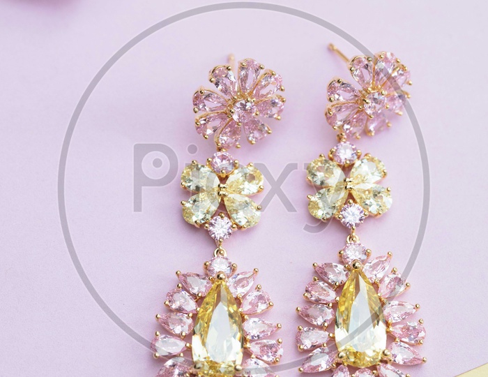 Peach and yellow colored crystal earrings