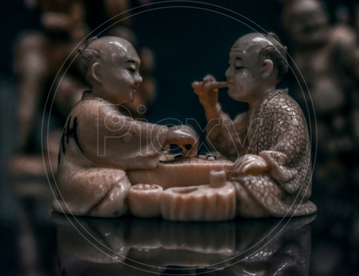 Eating monks- sculpture