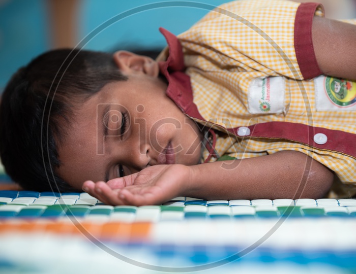 Student having a nap at an Anganwadi center