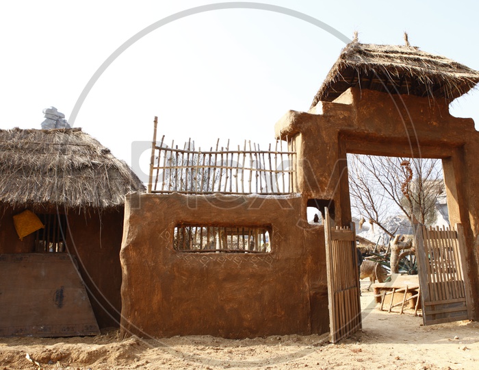 Arch Or Entrance Gate Of Rural Village  Homes With Clay Walls