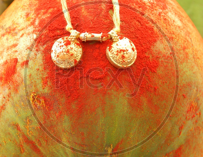 Close up shot of Mangalsutra on coconut
