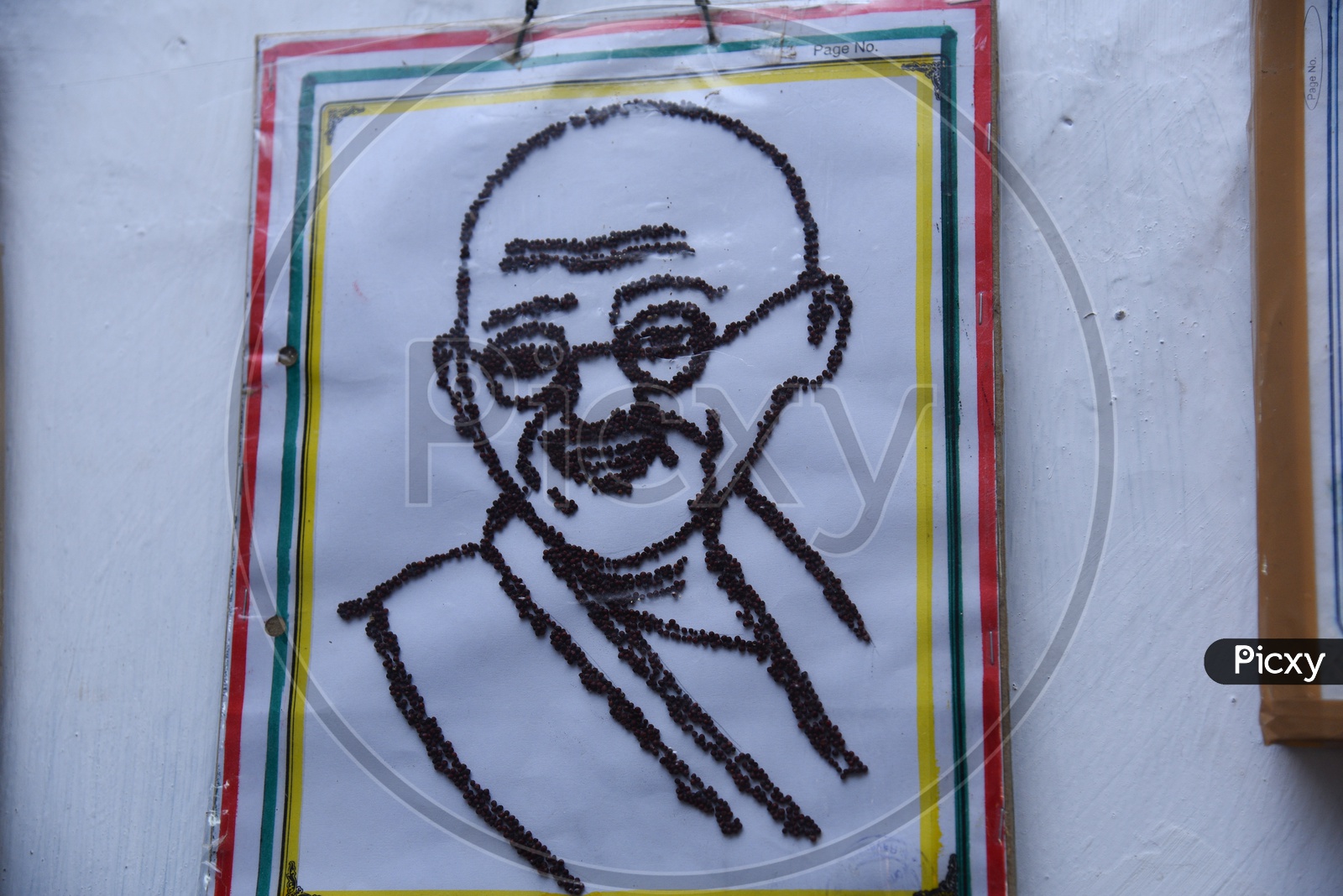 Mahatma Gandhi face drawing by government primary school students using mustard seeds