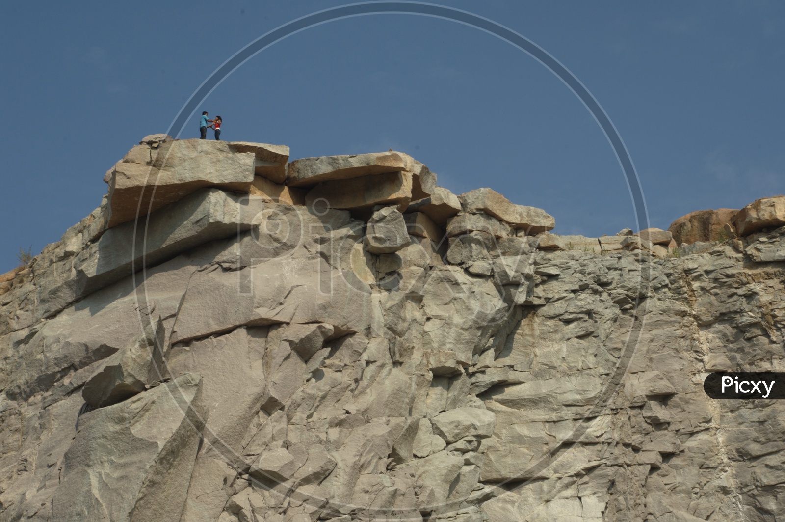 Couple standing on top of the Granite Quarry