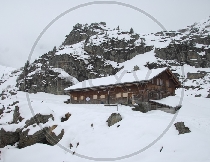 Wooden house amidst of the Swiss Alps