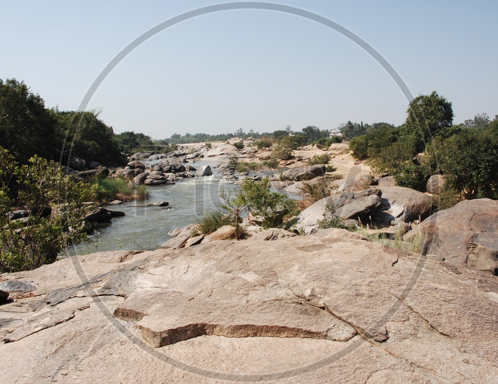 Tungabhadra River flowing along the Granite Boulders