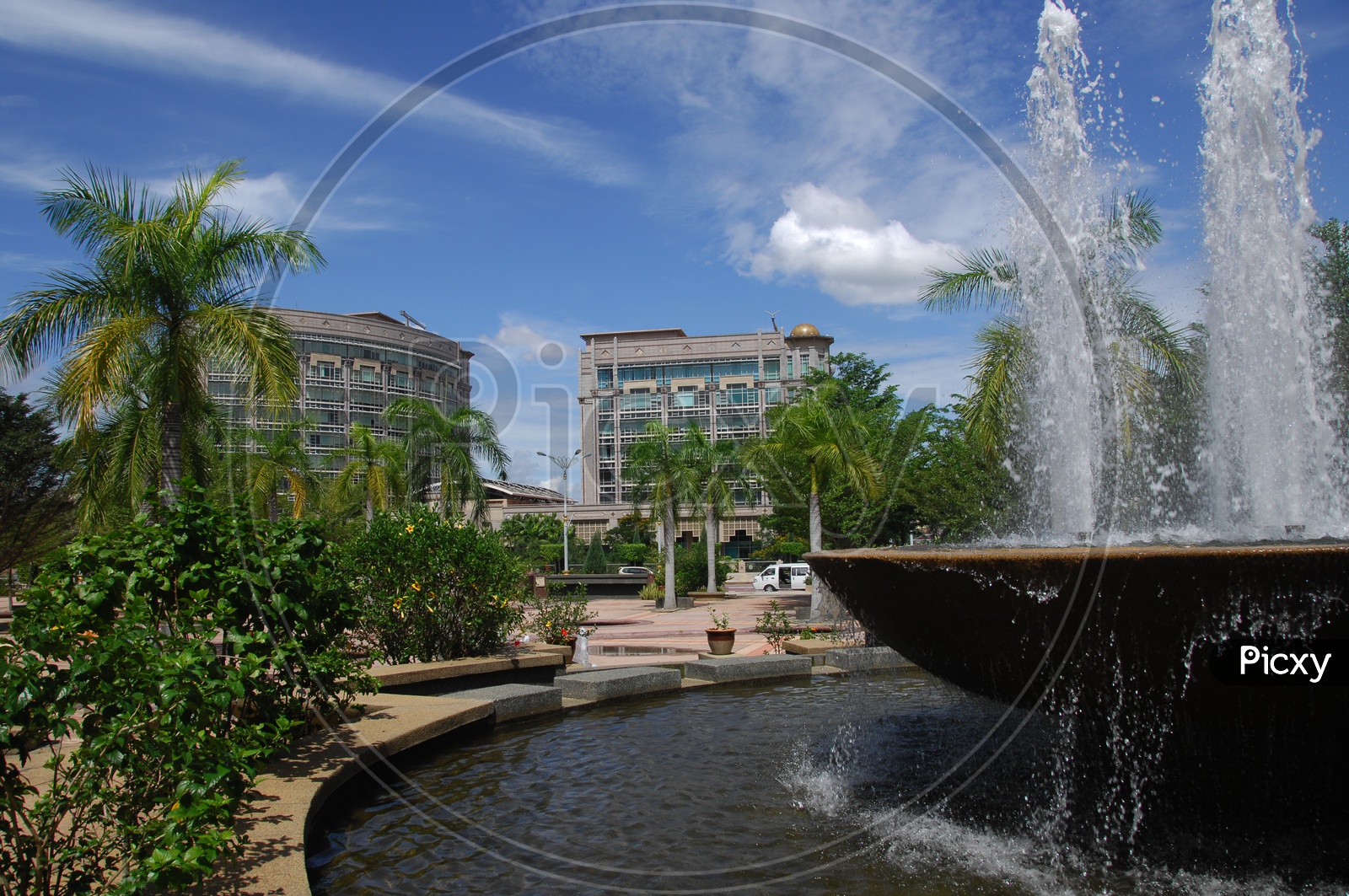 Buildings of Malaysia with waterfalls in the foreground
