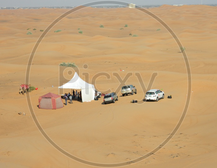 Desert tents and cars in the Sand Dunes