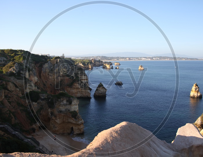 aerial view of ponta da piedade from the top of a cliff