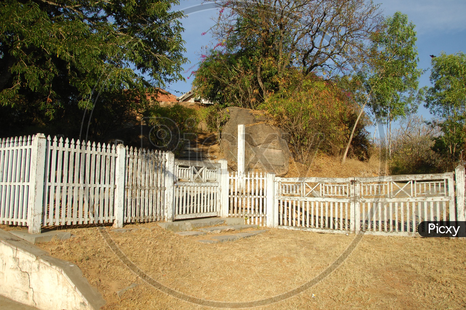 White fencing with a gate