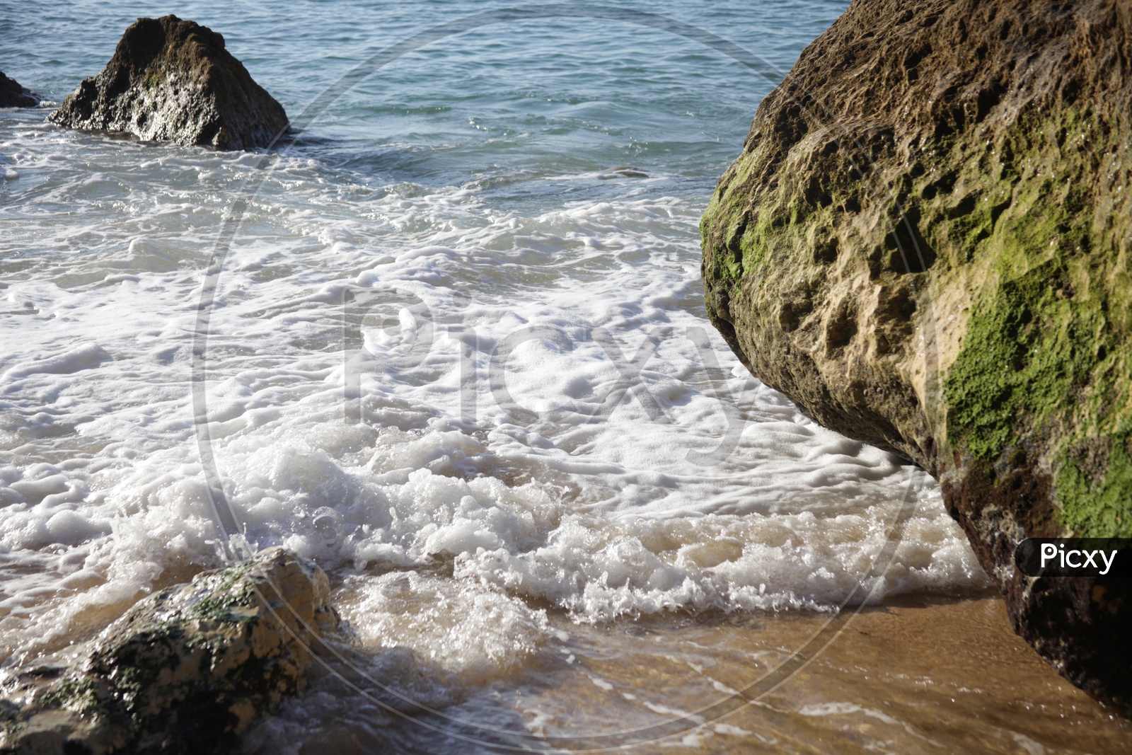 sea water touching the rocks in the  beach