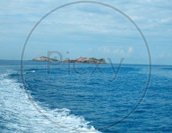 A wave in the sea and island at middle of the sea