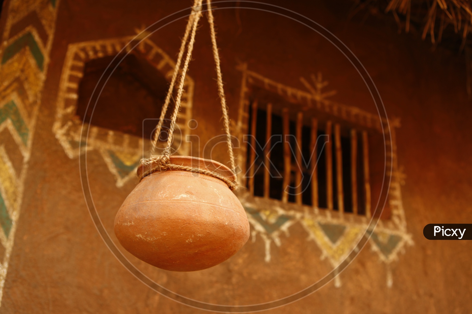 Hanged clay curd pot using a rope
