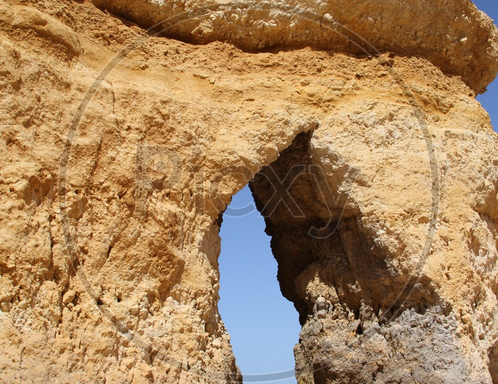 Arch shaped rock in a beach